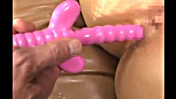 Woman moans while playing with sex toys