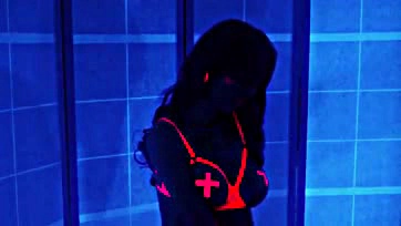 Orgasmic neon glow under black light, intense pleasure