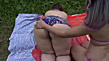 Lesbians enjoy sex in nature, featuring big butts