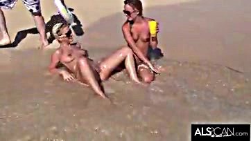 Lesbians engage in explicit, rough sex on public beach