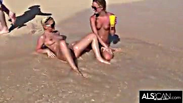 Lesbians engage in explicit, rough sex on public beach