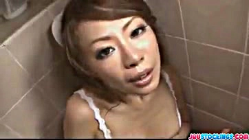 Asian nurse teases her vulva in provocative pose