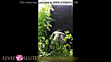 Woman masturbates with dildo in the garden