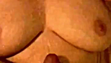 Wife strokes husband's cum on her saggy breasts