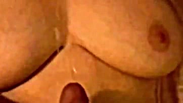 Wife strokes husband's cum on her saggy breasts