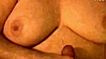 Wife strokes husband's cum on her saggy breasts