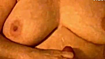 Wife strokes husband's cum on her saggy breasts