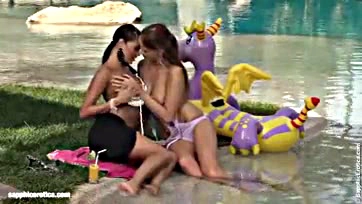 Lesbians passionately finger each other in the pool