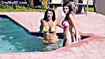 Sexy brown-haired women engage in explicit poolside sex