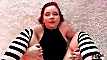 Sexy redhead swallows cum while wearing a bodysuit