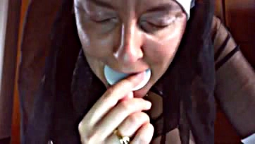 A nun curses and shoves holy wafers up her ass