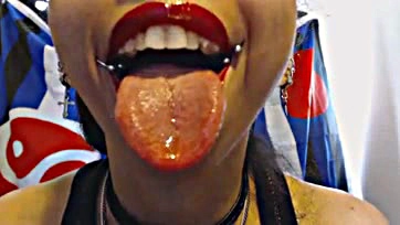 Freshly kissed lips spew sloppy, sticky snot