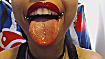 Freshly kissed lips spew sloppy, sticky snot