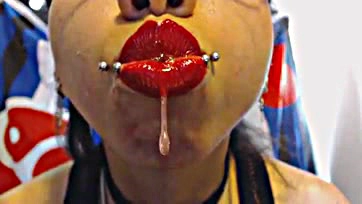 Freshly kissed lips spew sloppy, sticky snot