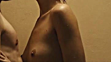 Margot Robbie shows off her bare breasts