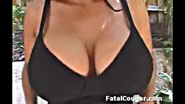 Mature woman exposes herself, showing breasts and genitalia