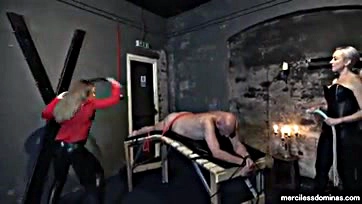 Two women brutally whip a helpless, screaming slave