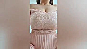 Adorable girl flaunts her large breasts on camera