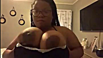 Sexy ebony milf gets her big tits off