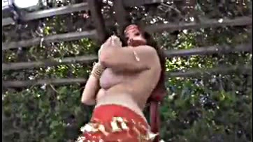 Foxy belly dancer strips in red dress, no sound