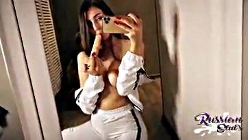 Fitness model teases her vulva in the mirror