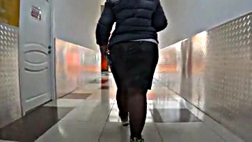 Fat mature woman's legs and ass exposed publicly