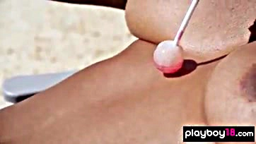 Asian chick flaunts massive tits on sunny beach