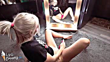 Blonde woman intensely orgasms with sex toys in mirror