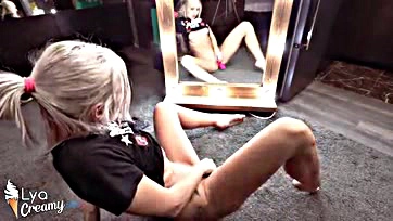 Blonde woman intensely orgasms with sex toys in mirror