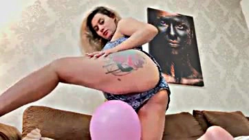 Pregnant blonde plays with balloons, flaunts her ass