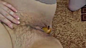 Woman masturbates with pear in wet vagina