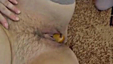 Woman masturbates with pear in wet vagina