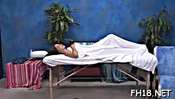 Youthful beauty receives intense erotic massage treatment