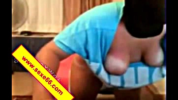 Nurse plays with saggy breasts of breastfeeding woman