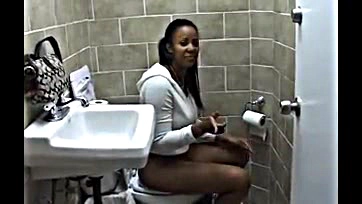 Woman pees in bathroom, sans underwear