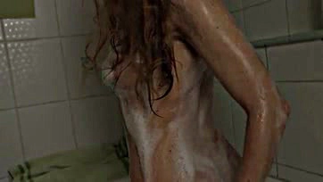 A slender beauty bathes with foamy pussy caress