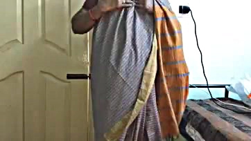 Indian wife shows off breasts, pubic area in grey saree