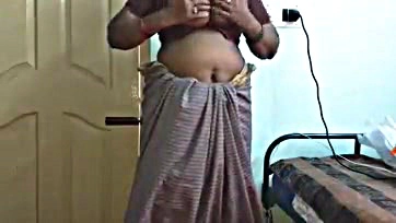 Indian wife shows off breasts, pubic area in grey saree