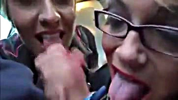 Two women give simultaneous oral sex on a bus