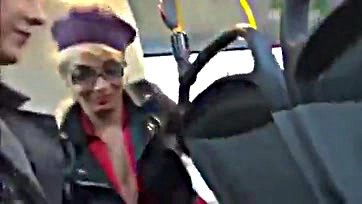 Two women give simultaneous oral sex on a bus