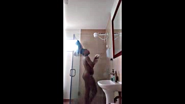 Girl drops dildo in shower, gets shocked and laughs