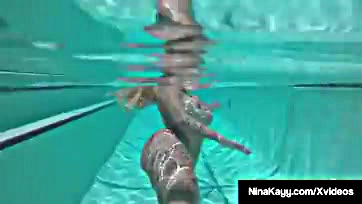 Nina masturbates her wet vagina underwater