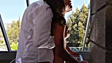 Girl gets spanked and fucked on the balcony