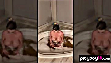 Sophie Dee masturbates solo in a bathtub