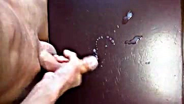 Man masturbates, producing large semen load