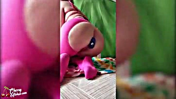 Femme plays with sex toys in a playful manner