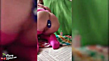 Femme plays with sex toys in a playful manner