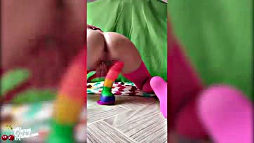 Femme plays with sex toys in a playful manner