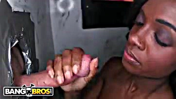 Black woman deep throats multiple large penises through holes