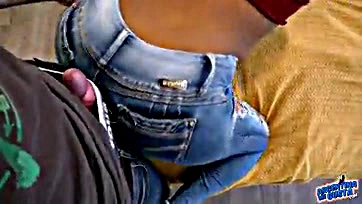 Sexy ebony woman flaunts curvy assets in tight jeans